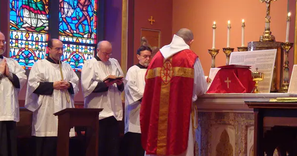 Priest serving mass - photo copyright Boston cc3