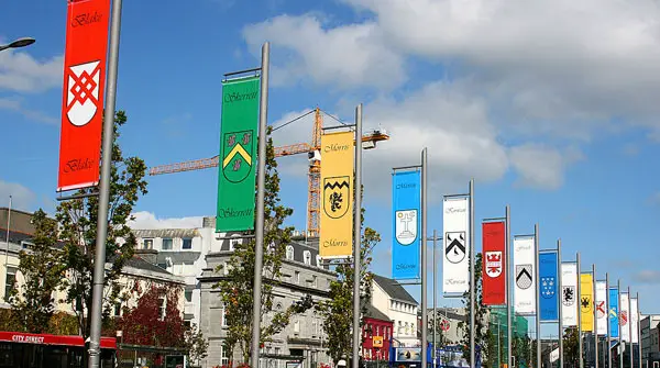 The flags of the 14 Tribes of Galway in Eyre Square, Galway. Photo copyright Eoin Gardiner CC2