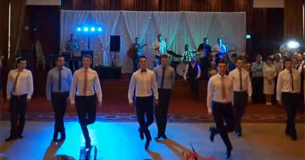 Groom Irish dances at his wedding reception