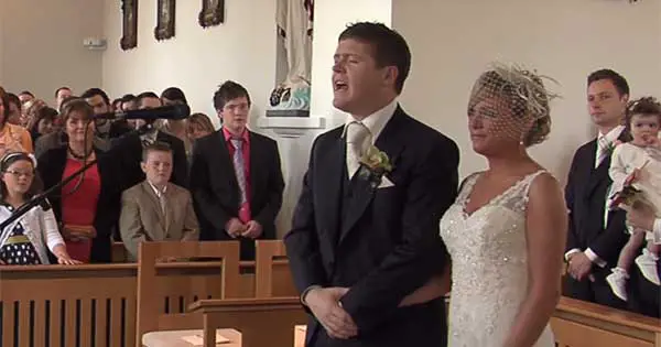 Groom sings his wife down to the aisle