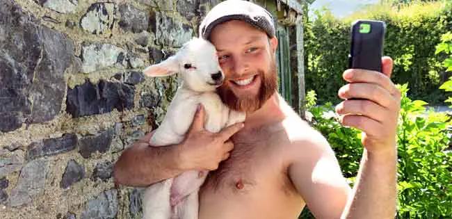 Irish farmer takes a selfie with a lamb