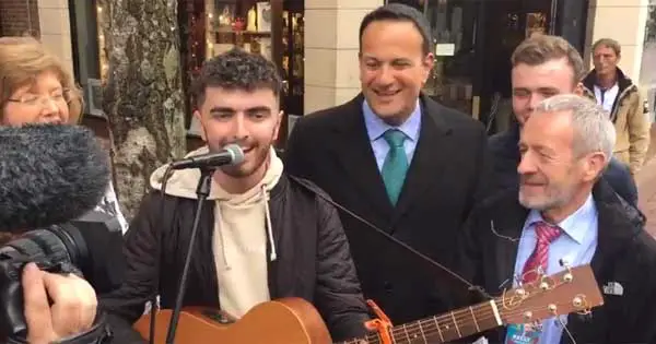 Taoiseach breaks from canvassing to singalong with busker