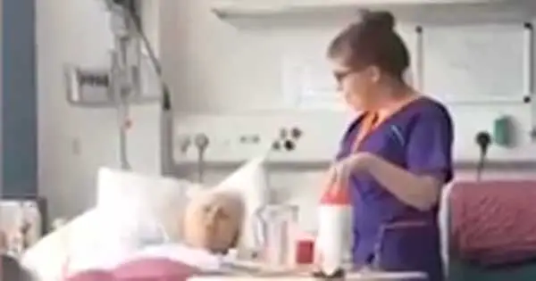 Irish nurse pauses to sing Amazing Grace with elderly patient