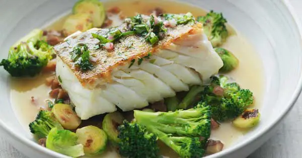 Braised cod with herb vinaigrette, toasted broccoli, sprouts and chestnuts
