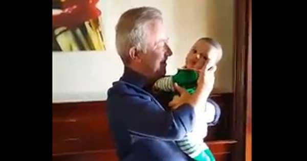 Grandad surprised by baby grandson